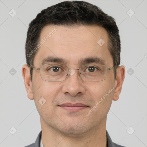 Joyful white adult male with short  brown hair and brown eyes