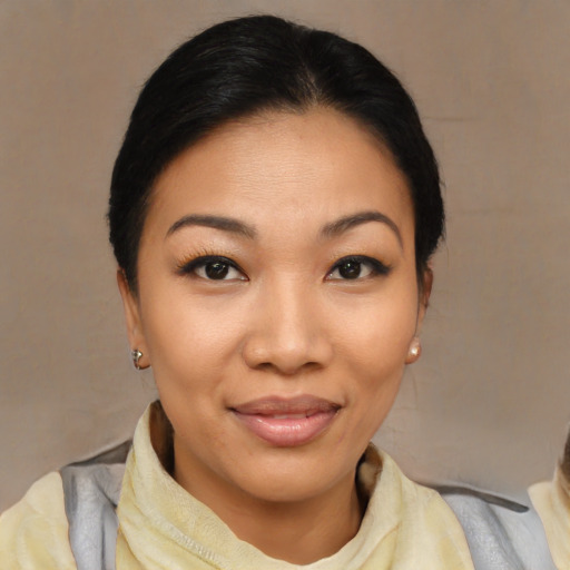 Joyful latino young-adult female with medium  black hair and brown eyes