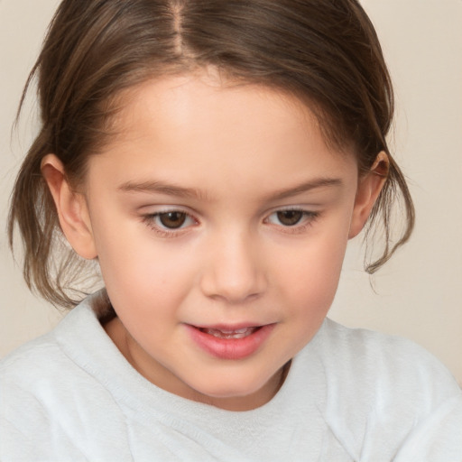 Joyful white child female with medium  brown hair and brown eyes