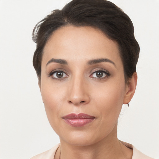 Joyful white young-adult female with short  brown hair and brown eyes