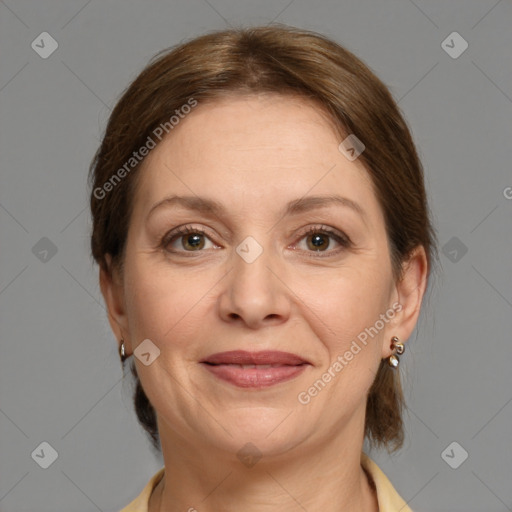 Joyful white adult female with medium  brown hair and grey eyes