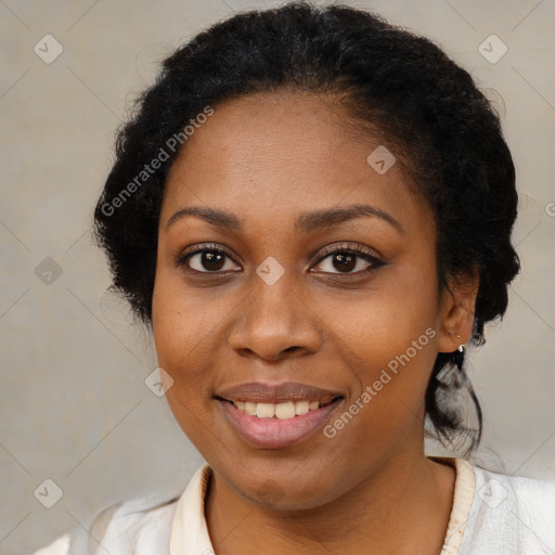 Joyful black young-adult female with medium  brown hair and brown eyes