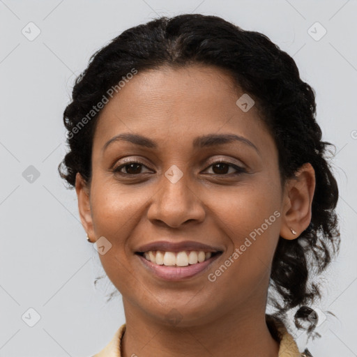 Joyful latino young-adult female with long  brown hair and brown eyes