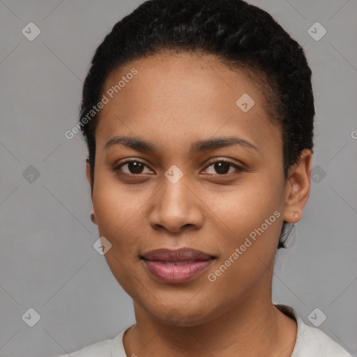 Joyful black young-adult female with short  brown hair and brown eyes