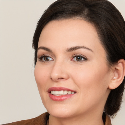 Joyful white young-adult female with medium  brown hair and brown eyes