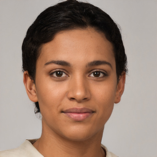 Joyful latino young-adult female with short  brown hair and brown eyes