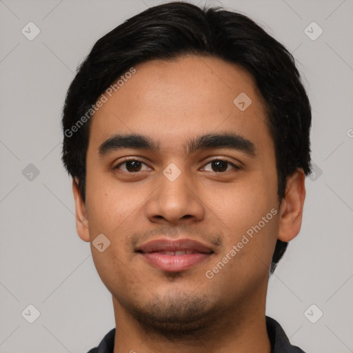 Joyful latino young-adult male with short  black hair and brown eyes