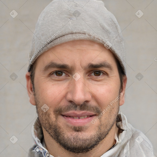 Joyful white adult male with short  brown hair and grey eyes