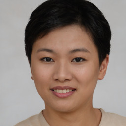 Joyful asian young-adult female with short  black hair and brown eyes