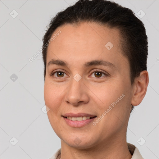 Joyful white adult female with short  brown hair and brown eyes