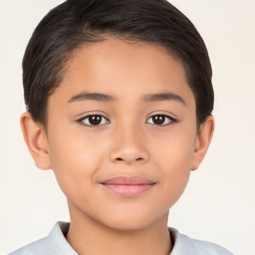 Joyful white child male with short  brown hair and brown eyes