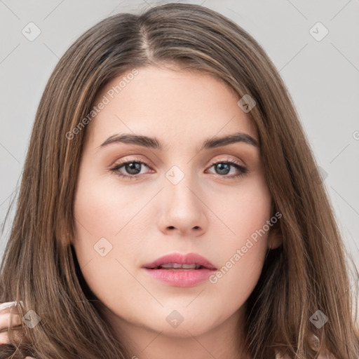 Neutral white young-adult female with long  brown hair and brown eyes