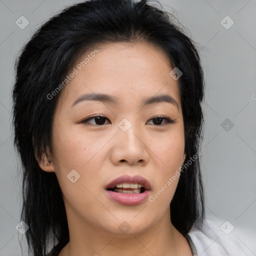 Joyful asian young-adult female with medium  black hair and brown eyes