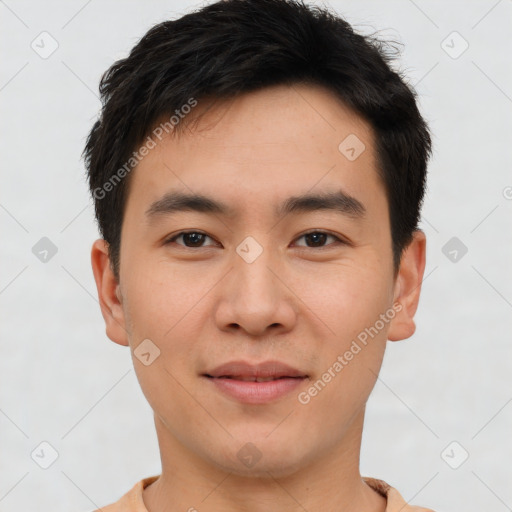 Joyful asian young-adult male with short  brown hair and brown eyes