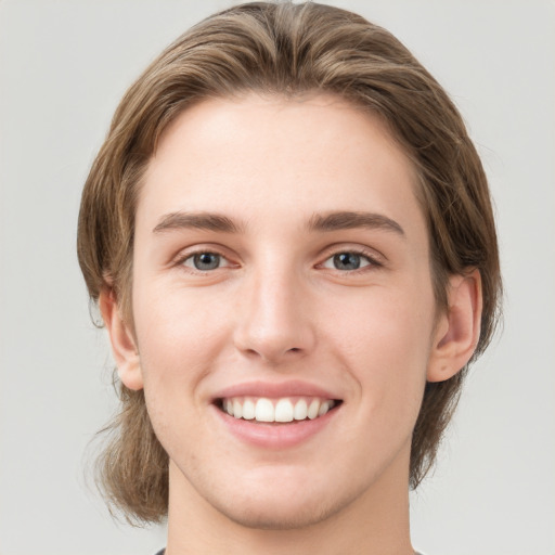 Joyful white young-adult female with medium  brown hair and green eyes