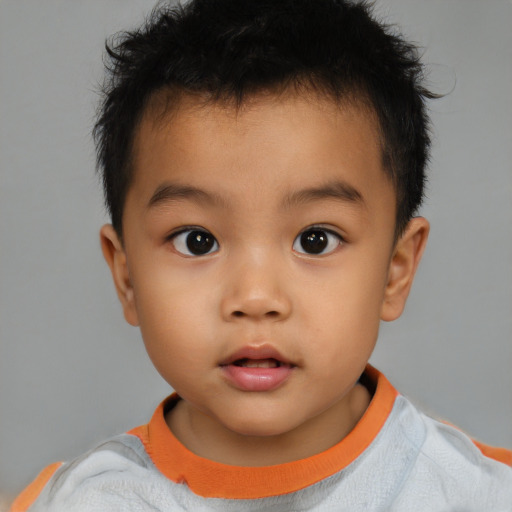 Neutral latino child male with short  brown hair and brown eyes