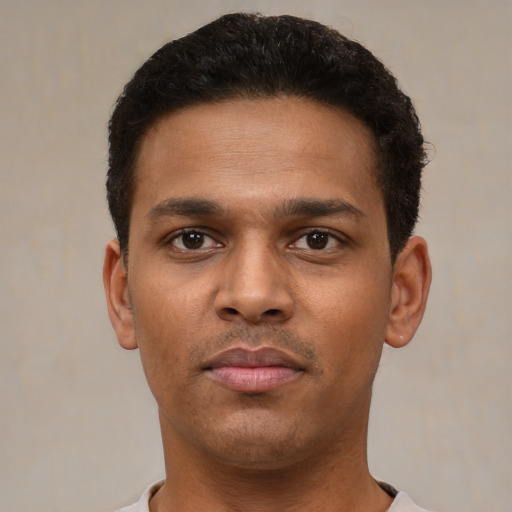 Neutral latino young-adult male with short  brown hair and brown eyes