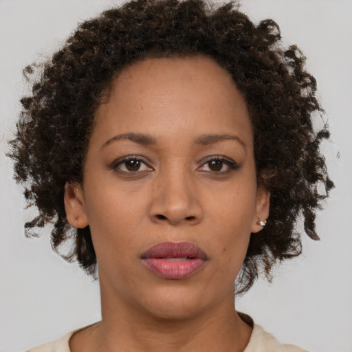 Neutral black young-adult female with short  brown hair and brown eyes