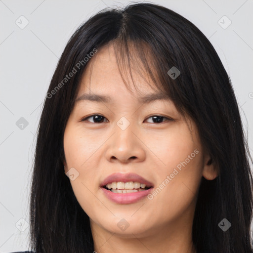 Joyful asian young-adult female with long  brown hair and brown eyes