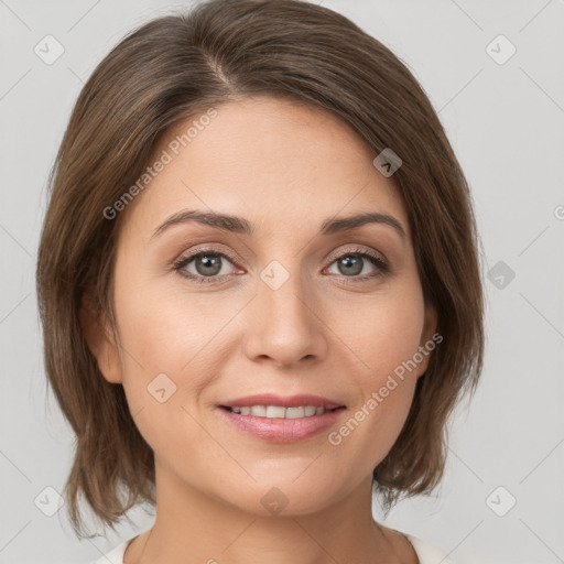 Joyful white young-adult female with medium  brown hair and green eyes