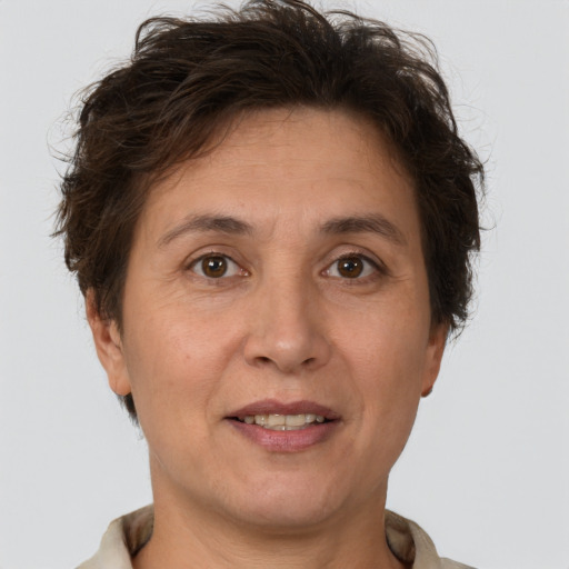 Joyful white adult female with short  brown hair and brown eyes