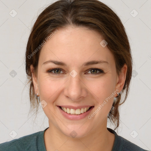 Joyful white young-adult female with medium  brown hair and grey eyes