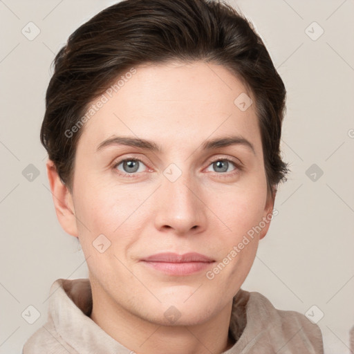 Joyful white young-adult female with short  brown hair and grey eyes