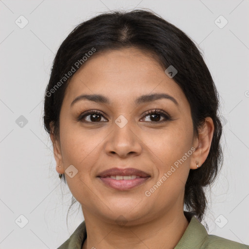 Joyful latino young-adult female with medium  brown hair and brown eyes