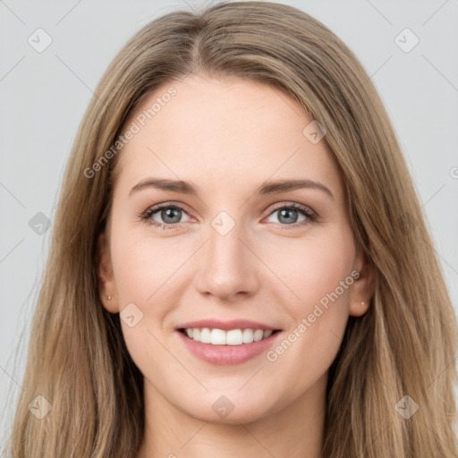 Joyful white young-adult female with long  brown hair and green eyes