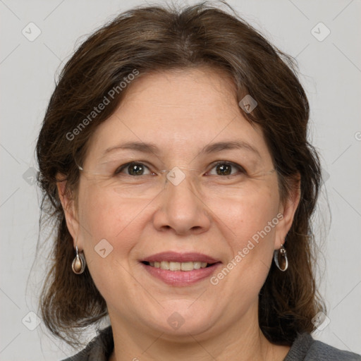 Joyful white adult female with medium  brown hair and grey eyes