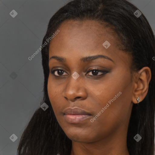 Neutral black young-adult female with long  brown hair and brown eyes