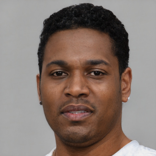 Neutral black young-adult male with short  black hair and brown eyes
