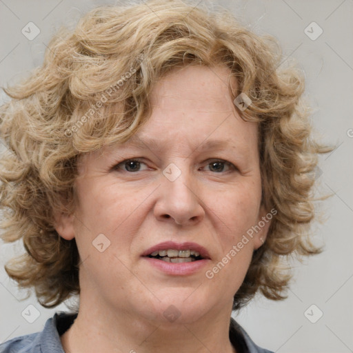 Joyful white adult female with medium  brown hair and blue eyes