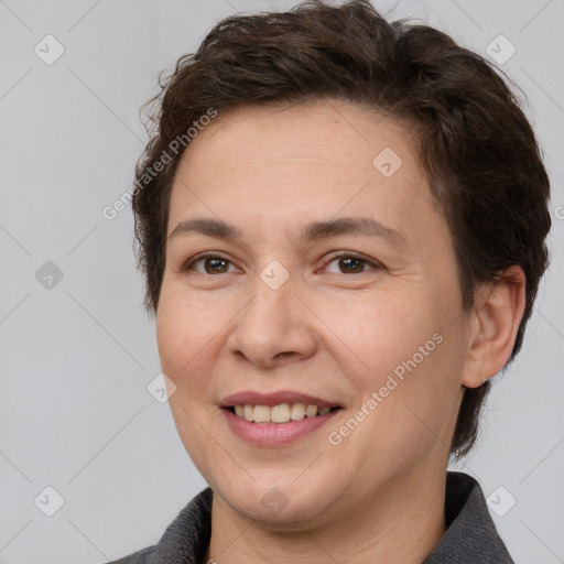 Joyful white adult female with short  brown hair and brown eyes