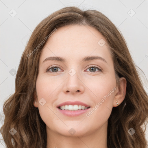 Joyful white young-adult female with long  brown hair and green eyes