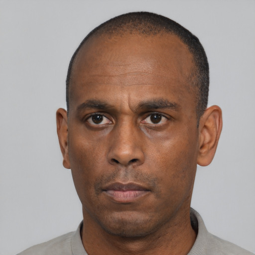 Neutral black adult male with short  black hair and brown eyes