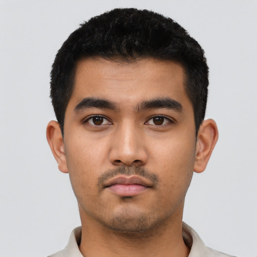 Neutral latino young-adult male with short  black hair and brown eyes