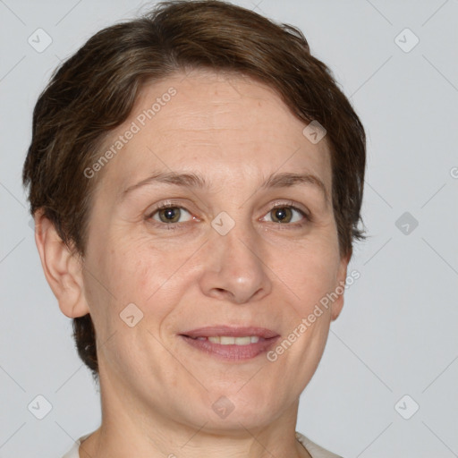 Joyful white adult female with short  brown hair and brown eyes