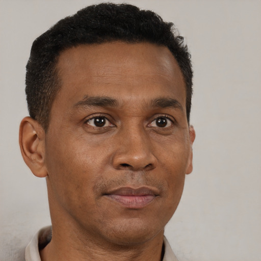 Neutral black adult male with short  brown hair and brown eyes