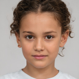 Joyful white child female with short  brown hair and brown eyes