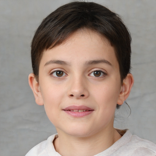 Joyful white child female with short  brown hair and brown eyes