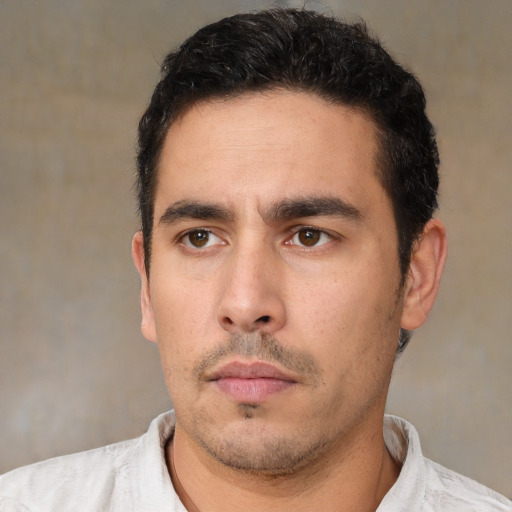 Neutral white young-adult male with short  black hair and brown eyes