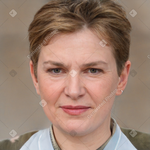 Joyful white adult female with short  brown hair and grey eyes