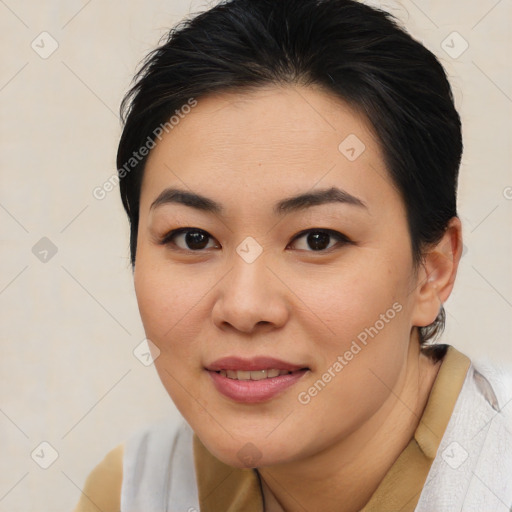 Joyful asian young-adult female with medium  brown hair and brown eyes