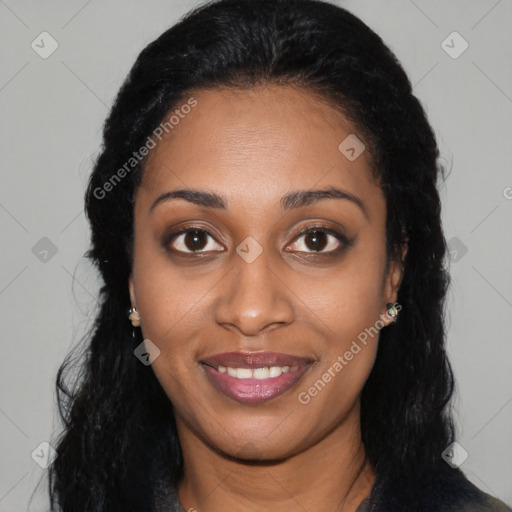 Joyful black young-adult female with long  black hair and brown eyes