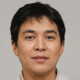 Neutral asian young-adult male with short  brown hair and brown eyes