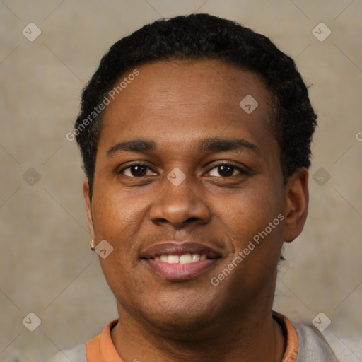 Joyful black young-adult male with short  black hair and brown eyes