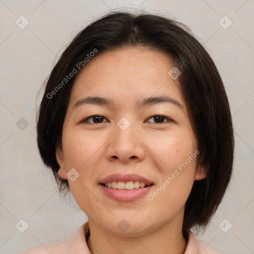 Joyful asian young-adult female with medium  brown hair and brown eyes