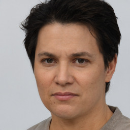 Joyful white adult female with short  brown hair and brown eyes