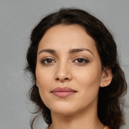 Joyful white young-adult female with medium  brown hair and brown eyes